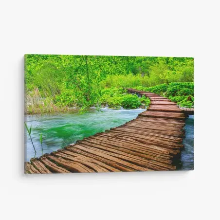Tableau sur toile passerelle en bois au milieu d'une nature luxuriante – Wallnifity®