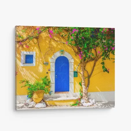 Tableau sur toile porte bleue d'Assos sur façade jaune – Wallnifity®